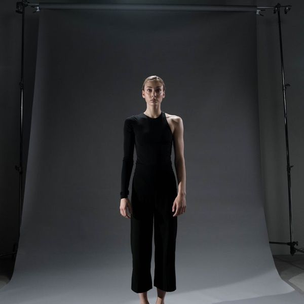 A person finding balance in a standing yoga posture.